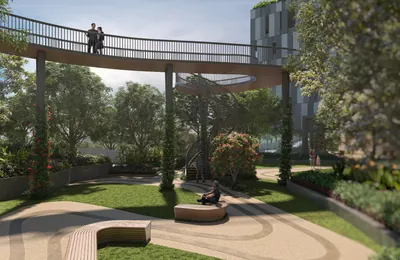 Colonnaded garden walk with benches and mature planting at ANP Privado